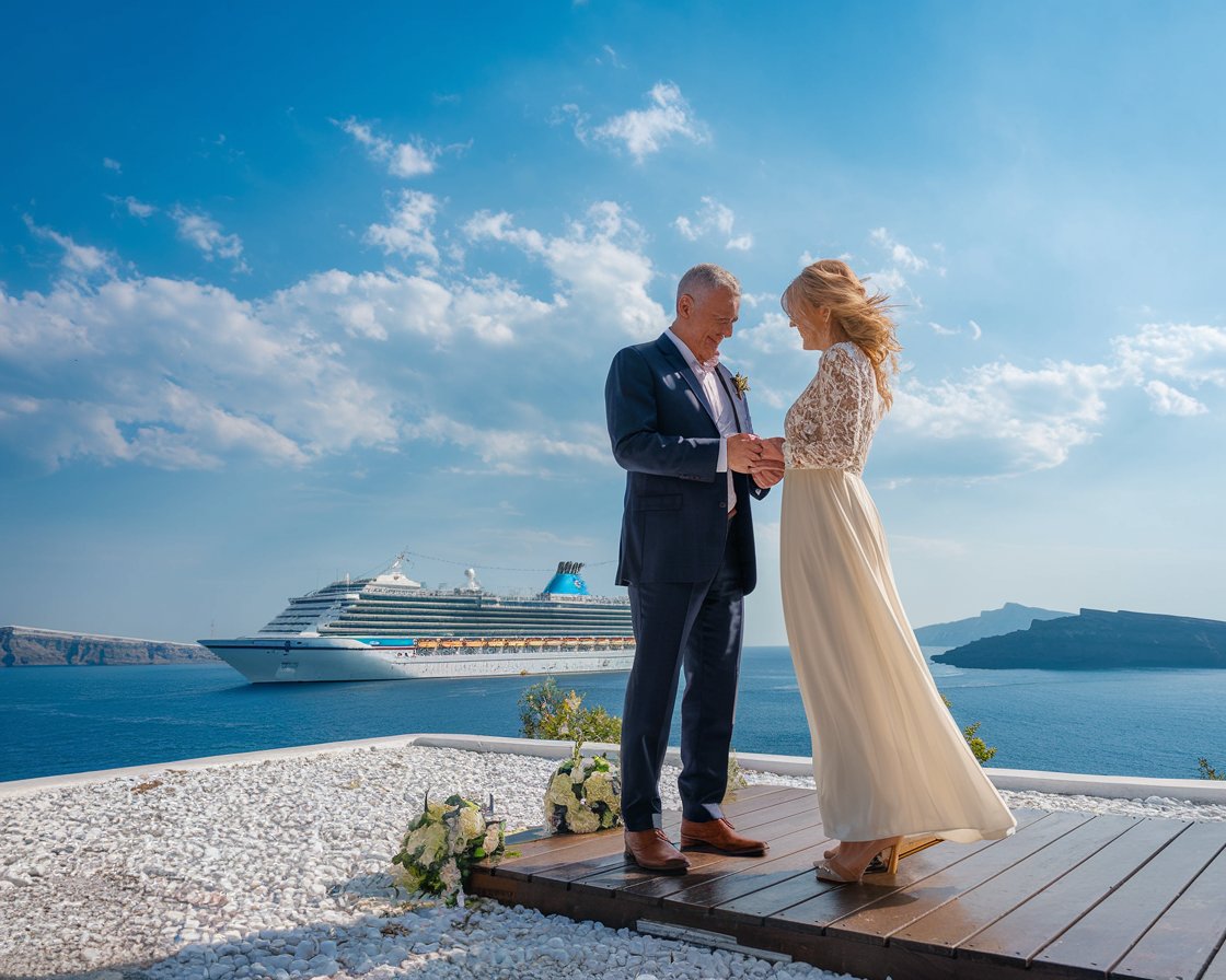 wedding couple in Greece with a cruise ship in the background