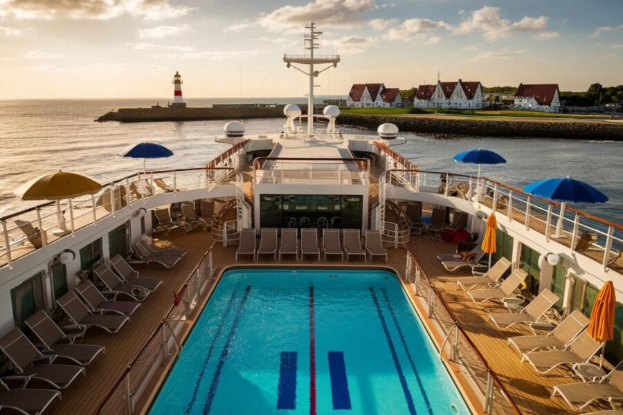 close up on cruise ship looking at the pool with Harwich in the background. Sunny day
