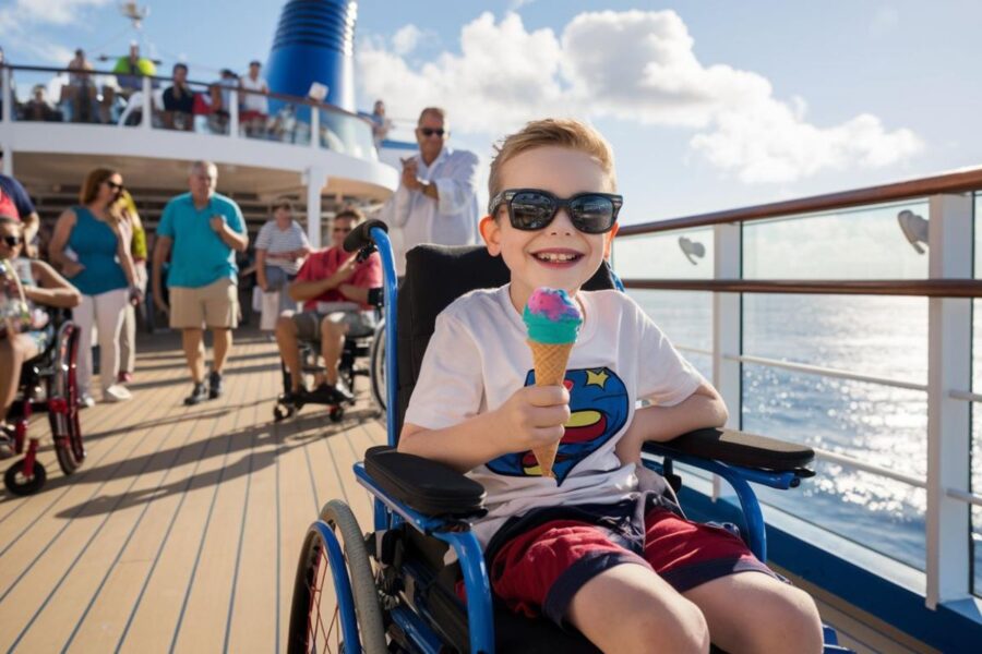 boy in a wheelchairn a family cruise ship