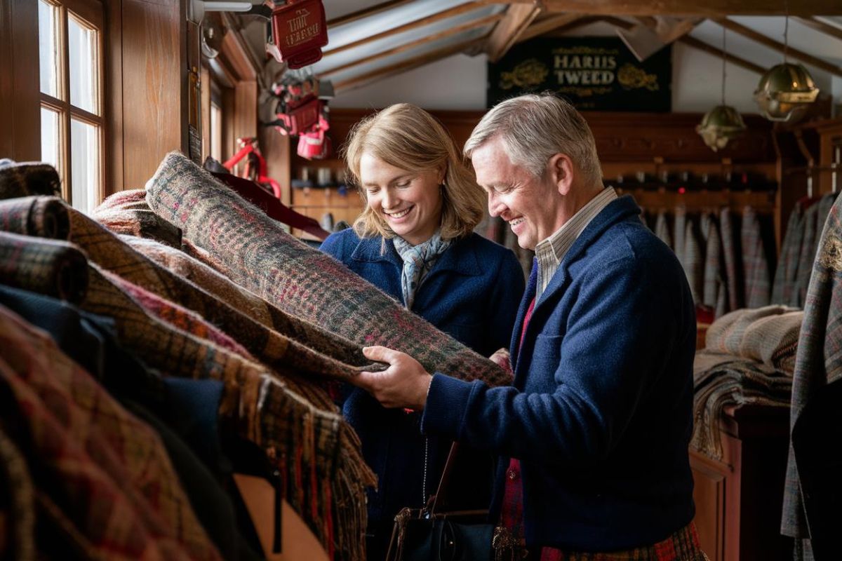 2 guests in a Harris Tweed shop on a Hebridean Island Cruise in Scotland