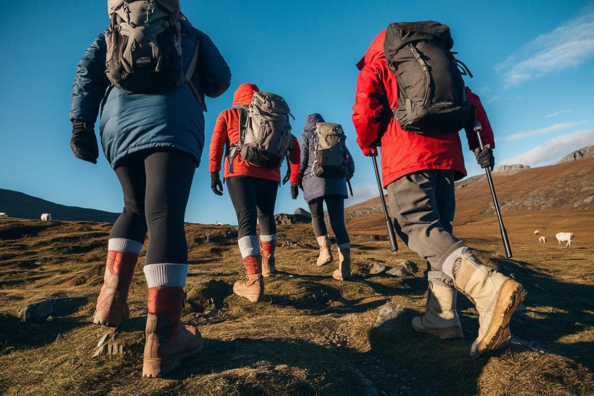 4 walkers on rugged Hills in Scotland on Hebridean Island Cruise