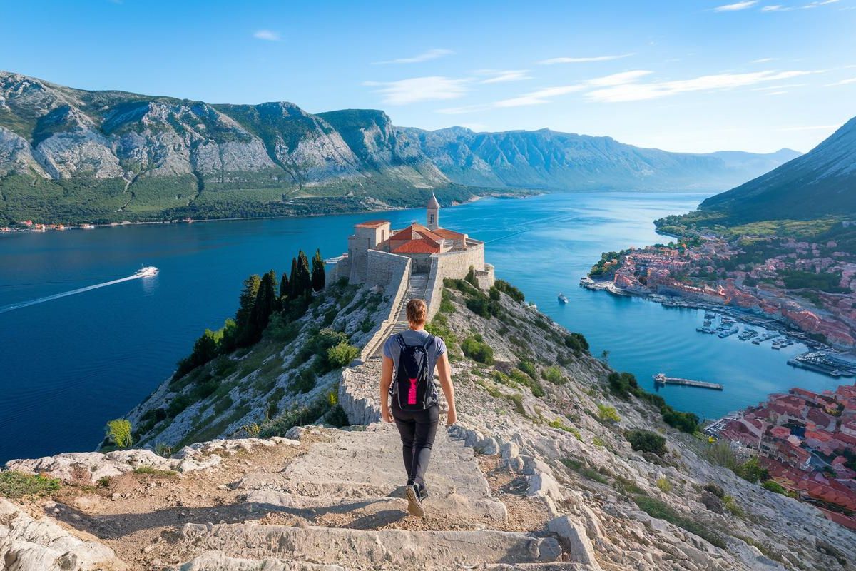 Hike Up to St. John’s Fortress Epic view of Kotor Bay and the Old Town below. Cruise ship in Kotor, Montenegro