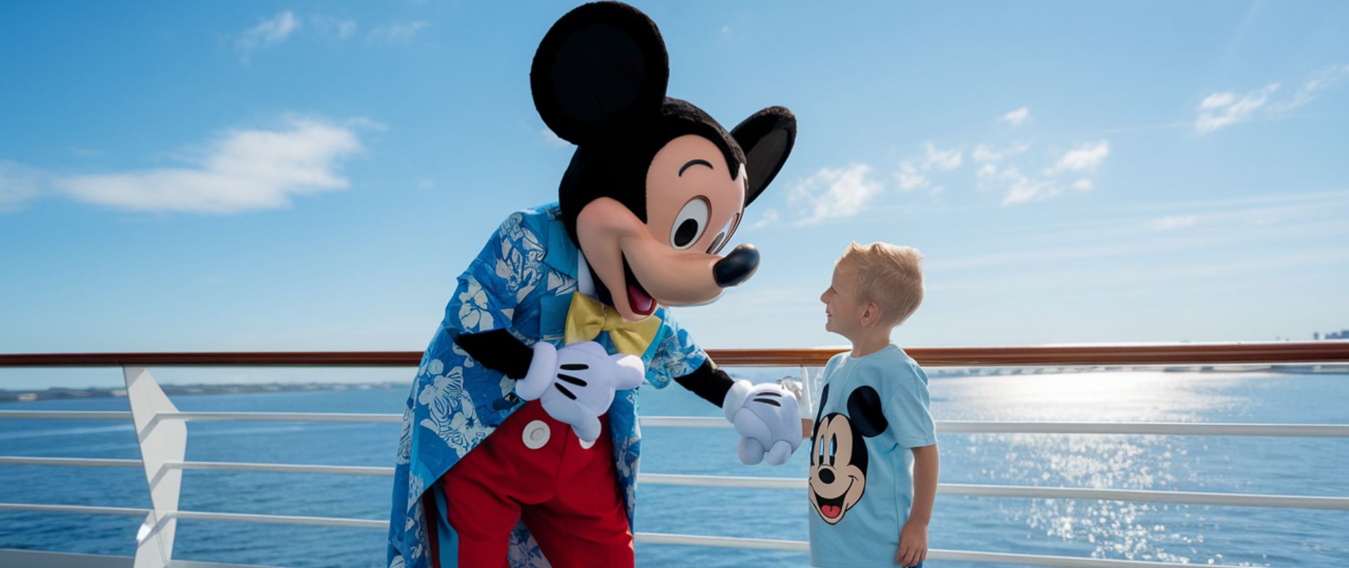 Micky Mouse meeting a child on a Disney Cruise