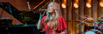 Singer in the theater of a cruise ship