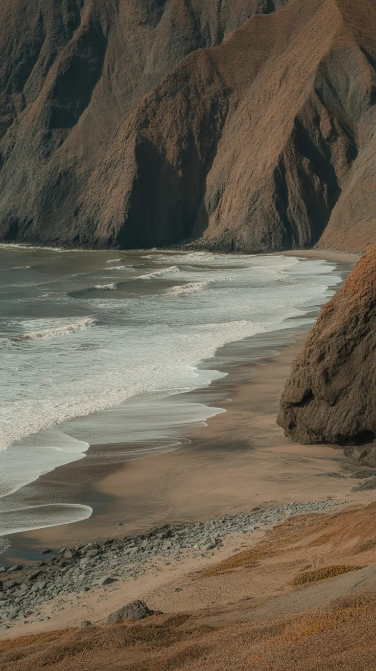 A rugged, windward side beach with dramatic cliffs and surf, better for scenic views than swimming; offers adventurous vibes but no amenities.