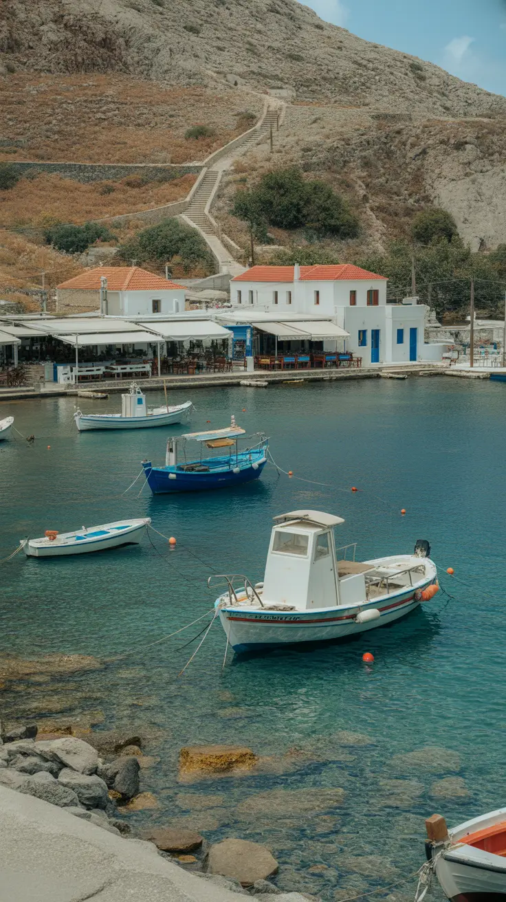 Accessible by a 300-step descent from Oia, this tiny bay features fishing boats, crystal-clear water, and cozy tavernas serving ultra-fresh seafood.