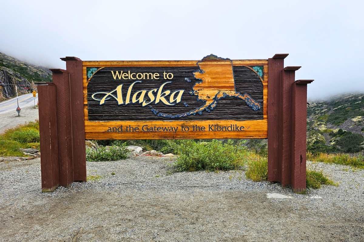 The Welcome to Alaska sign board on the way to the Suspension bridge
