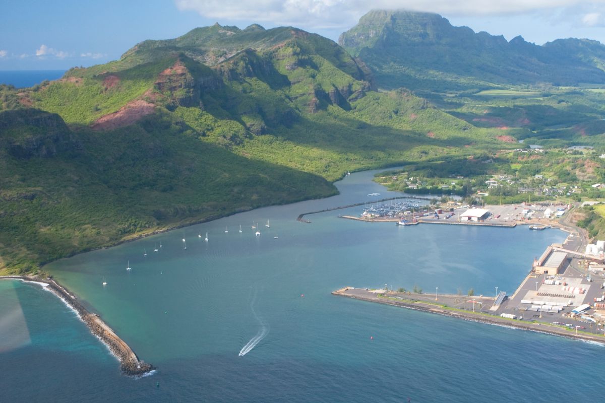 Aerial photograph of Nawiliwili cruise port showing harbor, docks, yacht basin and Kauai mountains