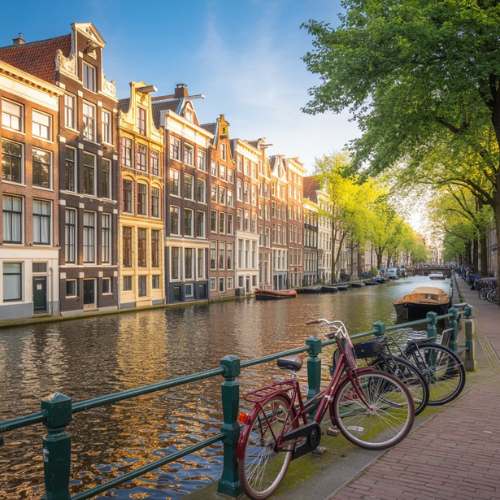 Amsterdam canal houses and bicycles on a sunny morning, Netherlands