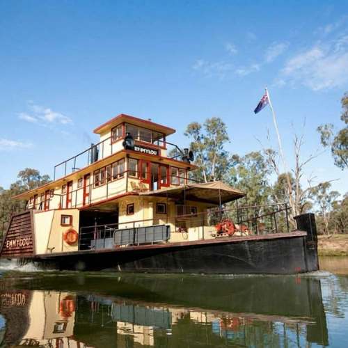 Historic Australian paddle steamer cruising the Murray River with the Australian flag flying