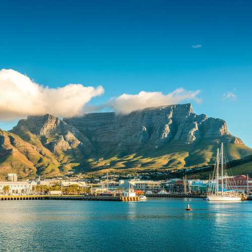 Cape Town waterfront with Table Mountain and clouds above, South Africa