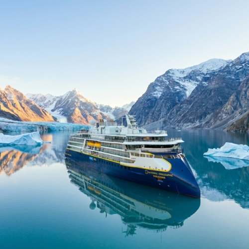 National Geographic expedition ship anchored among icebergs and glaciers in Arctic waters