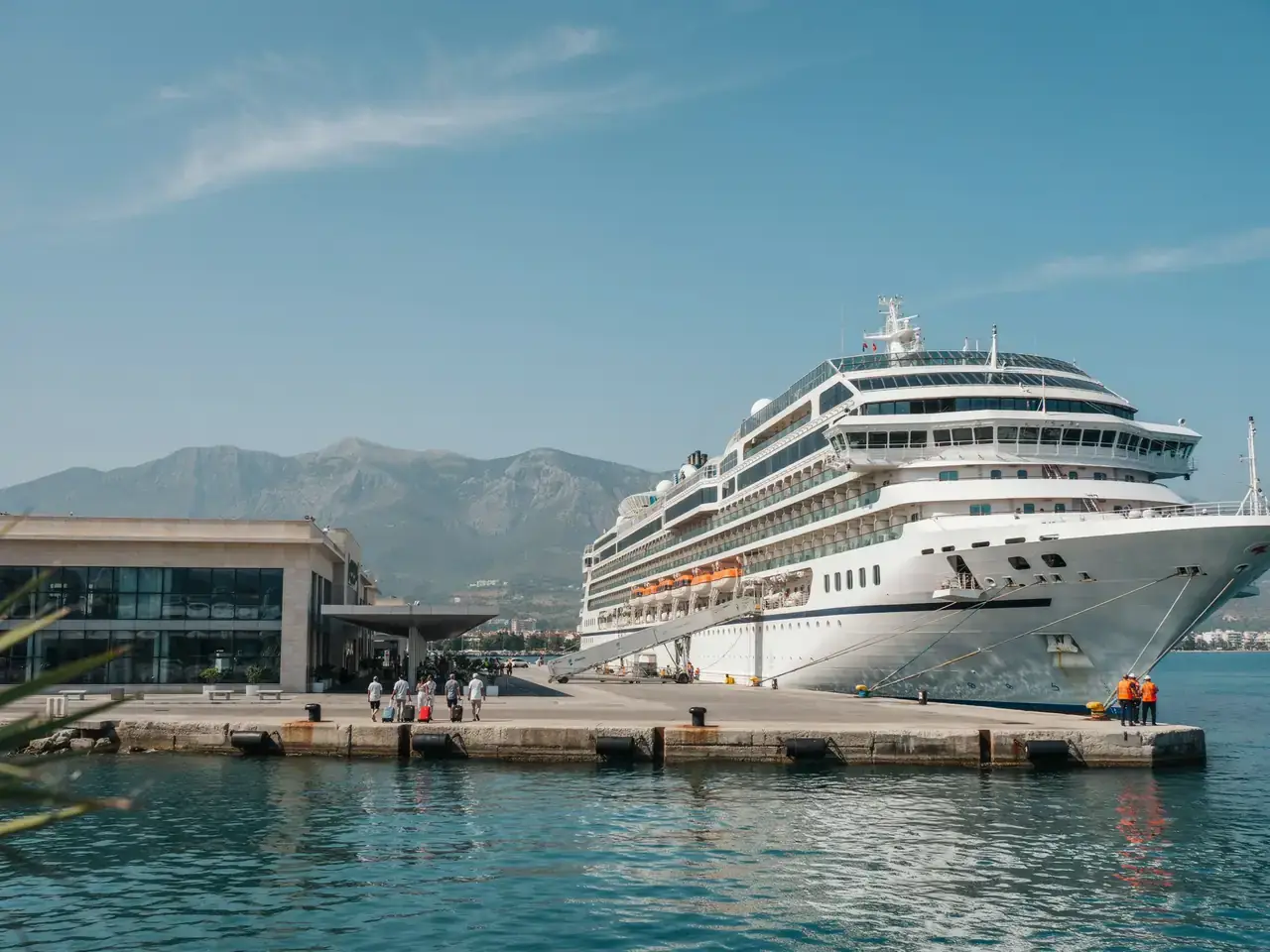 Cruise terminal building at the port of Alanya with a docked ship