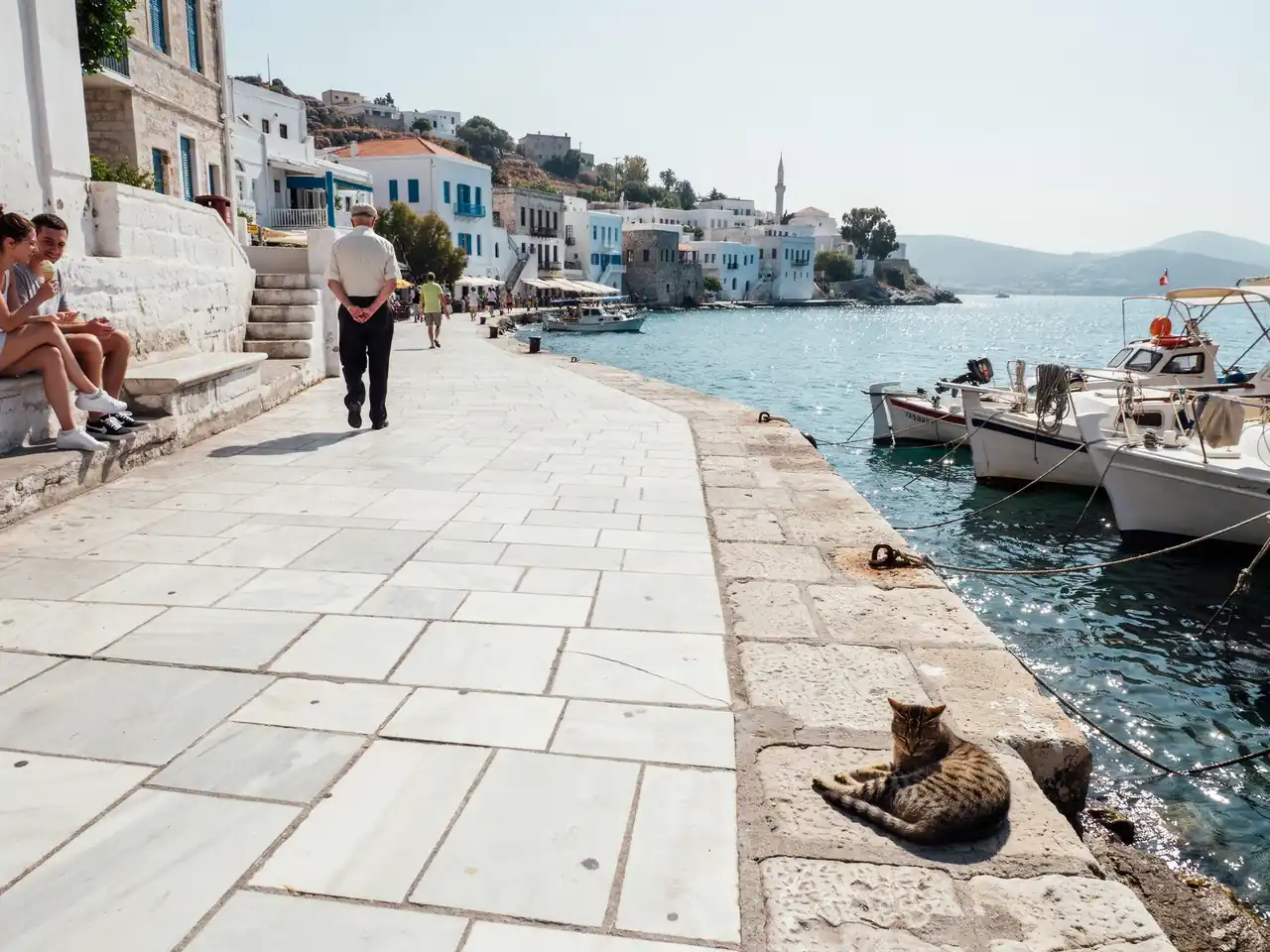 Harbourfront walkway leading from the Bodrum cruise port towards the town centre on a sunny day