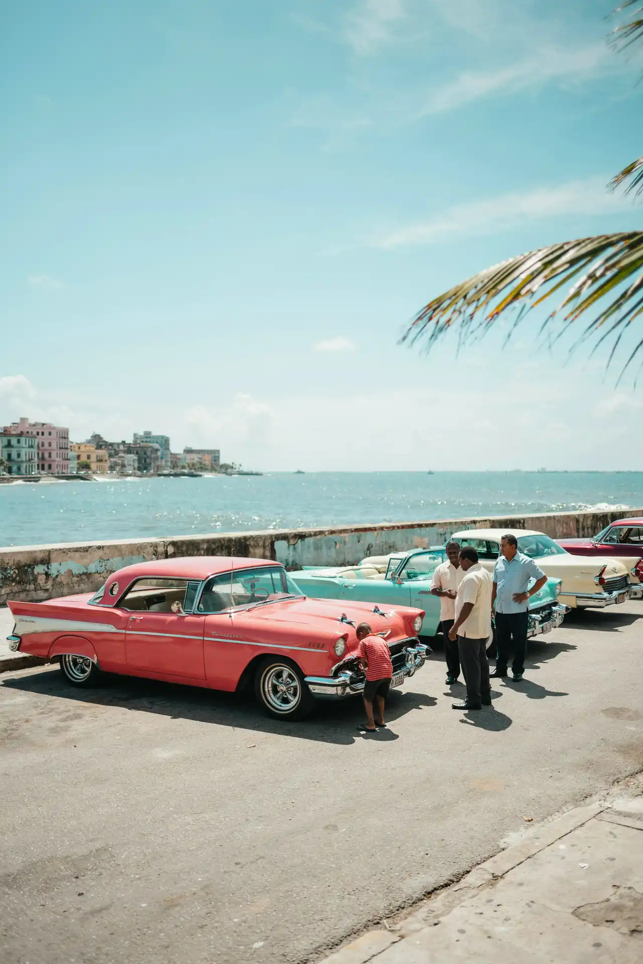 Colourful classic cars parked along the Havana harbourfront on a sunny day