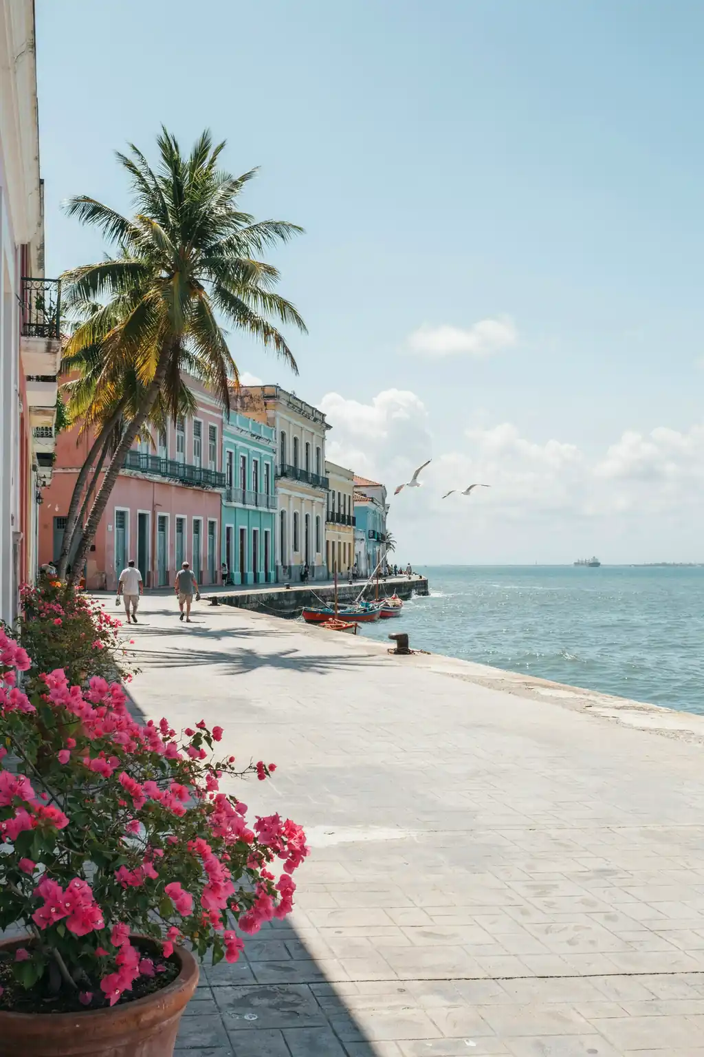 Waterfront view of Colón, Panama, with colonial-style buildings along the coastline