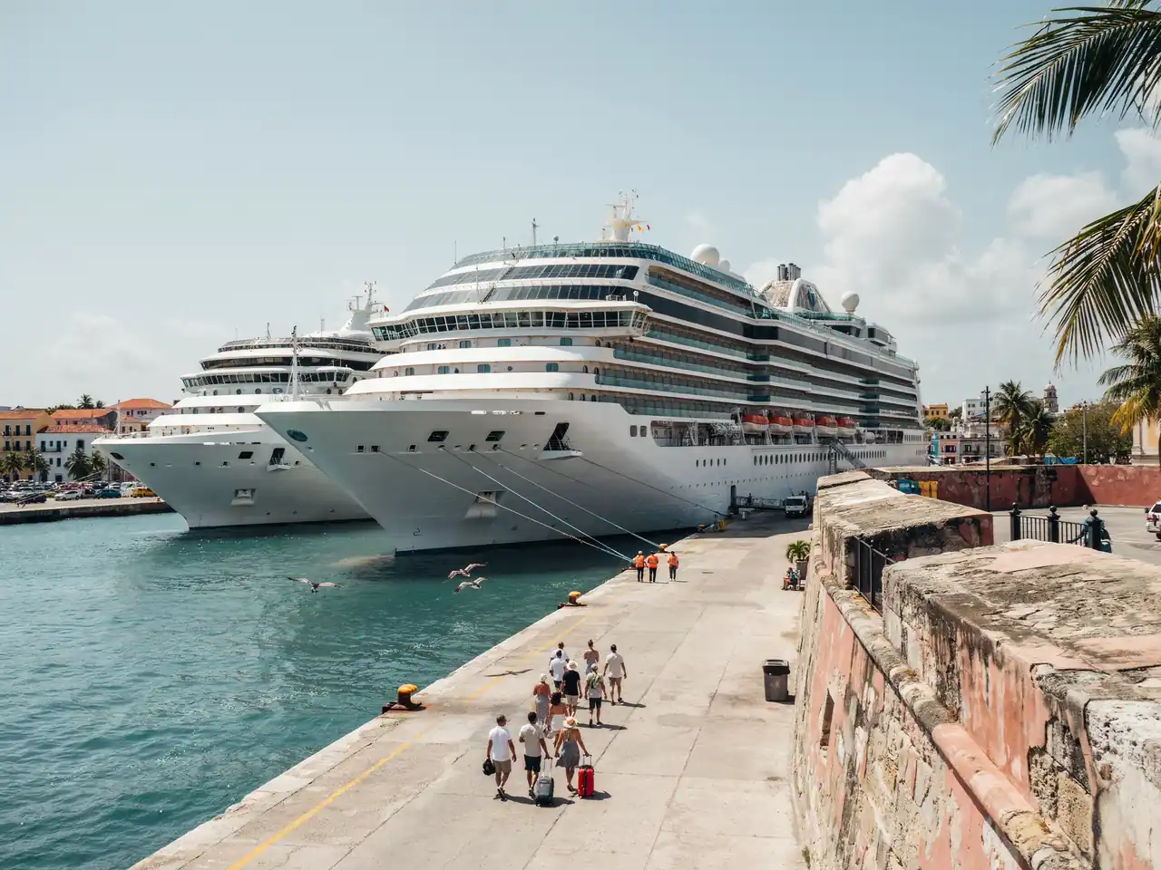 Cruise ships docked at a pier in San Juan, Puerto Rico on a sunny day