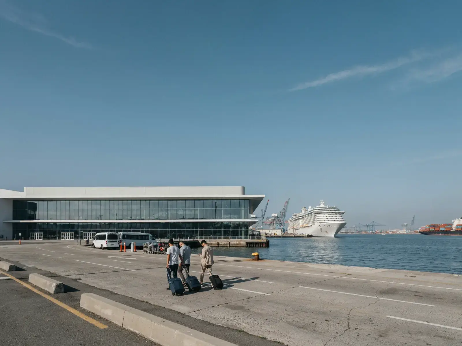 Exterior view of a cruise terminal building alongside the harbour in Long Beach on a sunny day