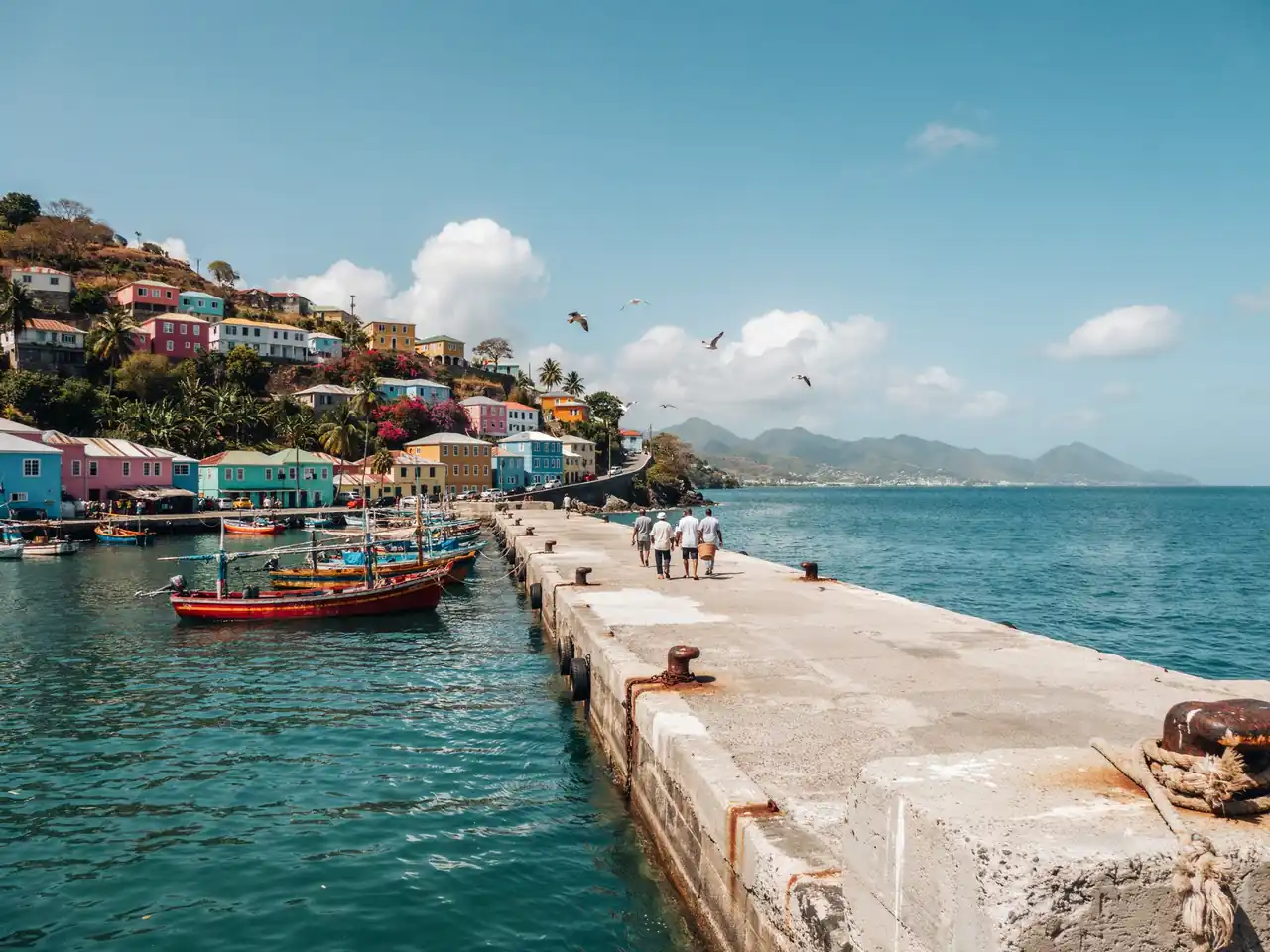View of the pier and nearby streets in Kingstown, Saint Vincent, with the harbour visible on a sunny day