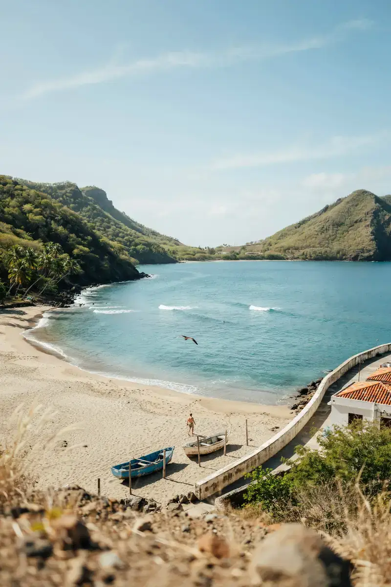 Coastal view of Little Bay harbour in Montserrat with hills in the background under a sunny sky