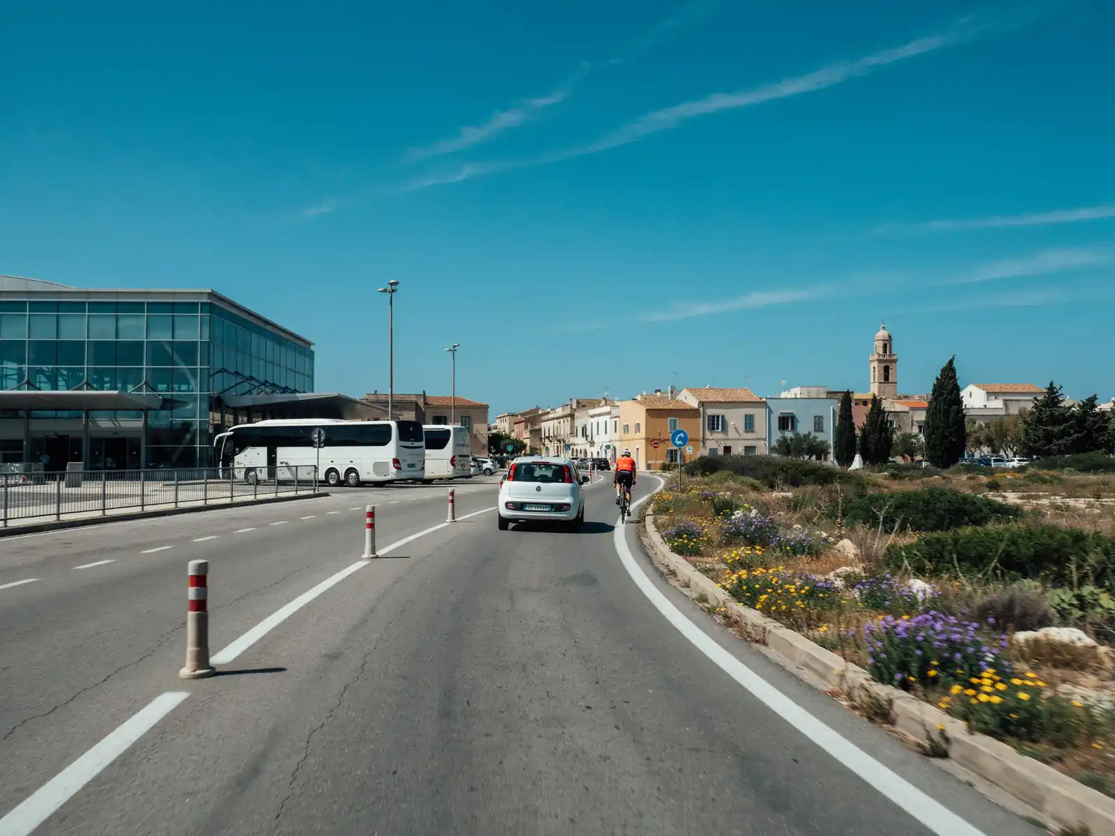 Road leading from the Olbia cruise terminal towards the city centre on a sunny day
