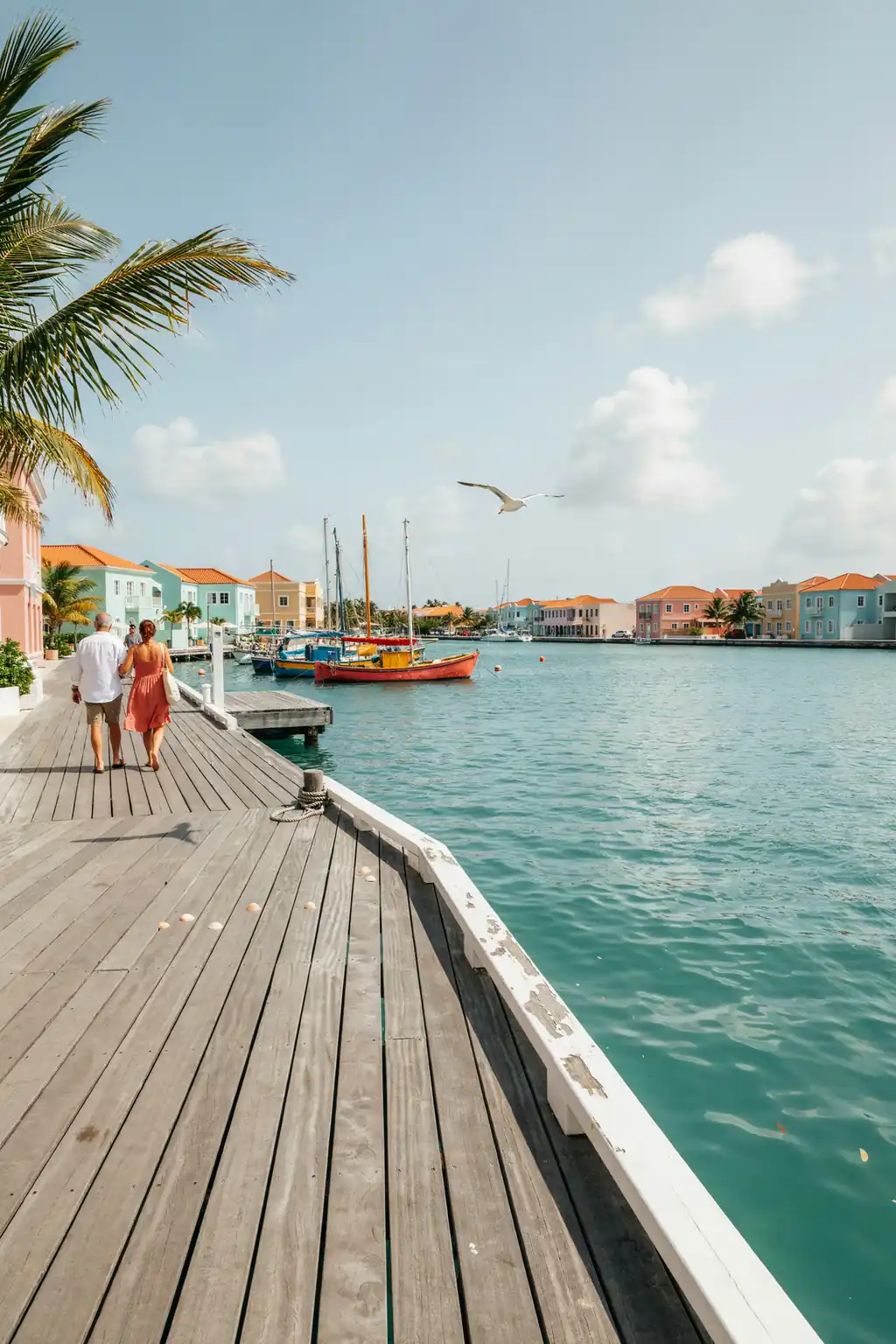 Waterfront boardwalk in Philipsburg with a view of the harbour and turquoise sea