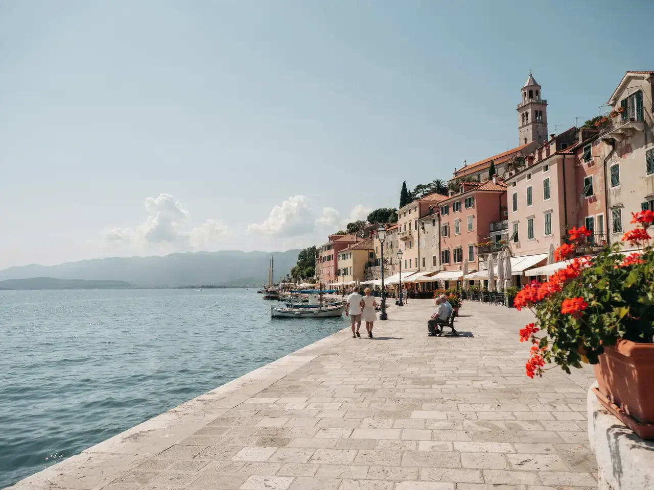Harbourfront promenade with old town buildings in Rijeka on a sunny day