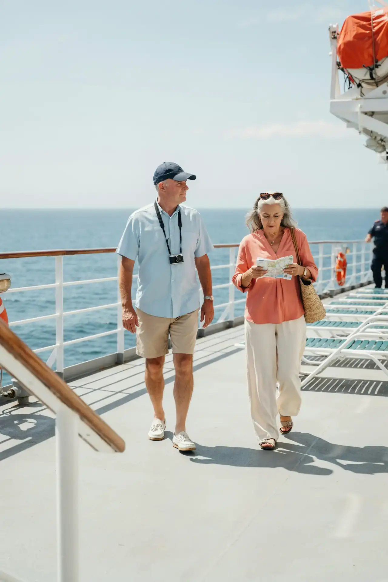 A group of older tourists walking together in sunny weather