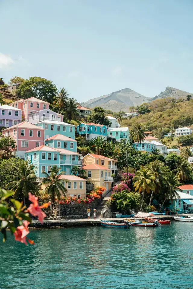Colourful harbourfront buildings on a hillside overlooking the bay in St George's, Grenada