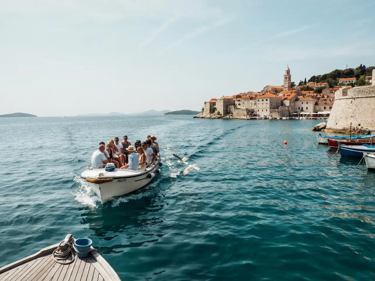Tender boat carrying cruise passengers towards the harbour in Hvar