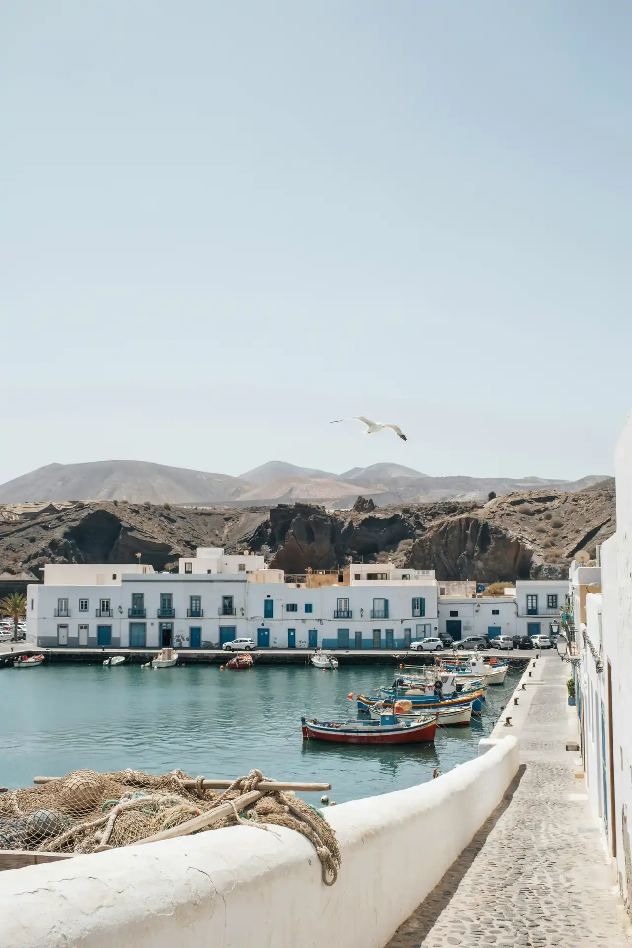Arrecife harbour with whitewashed buildings along a volcanic coastline