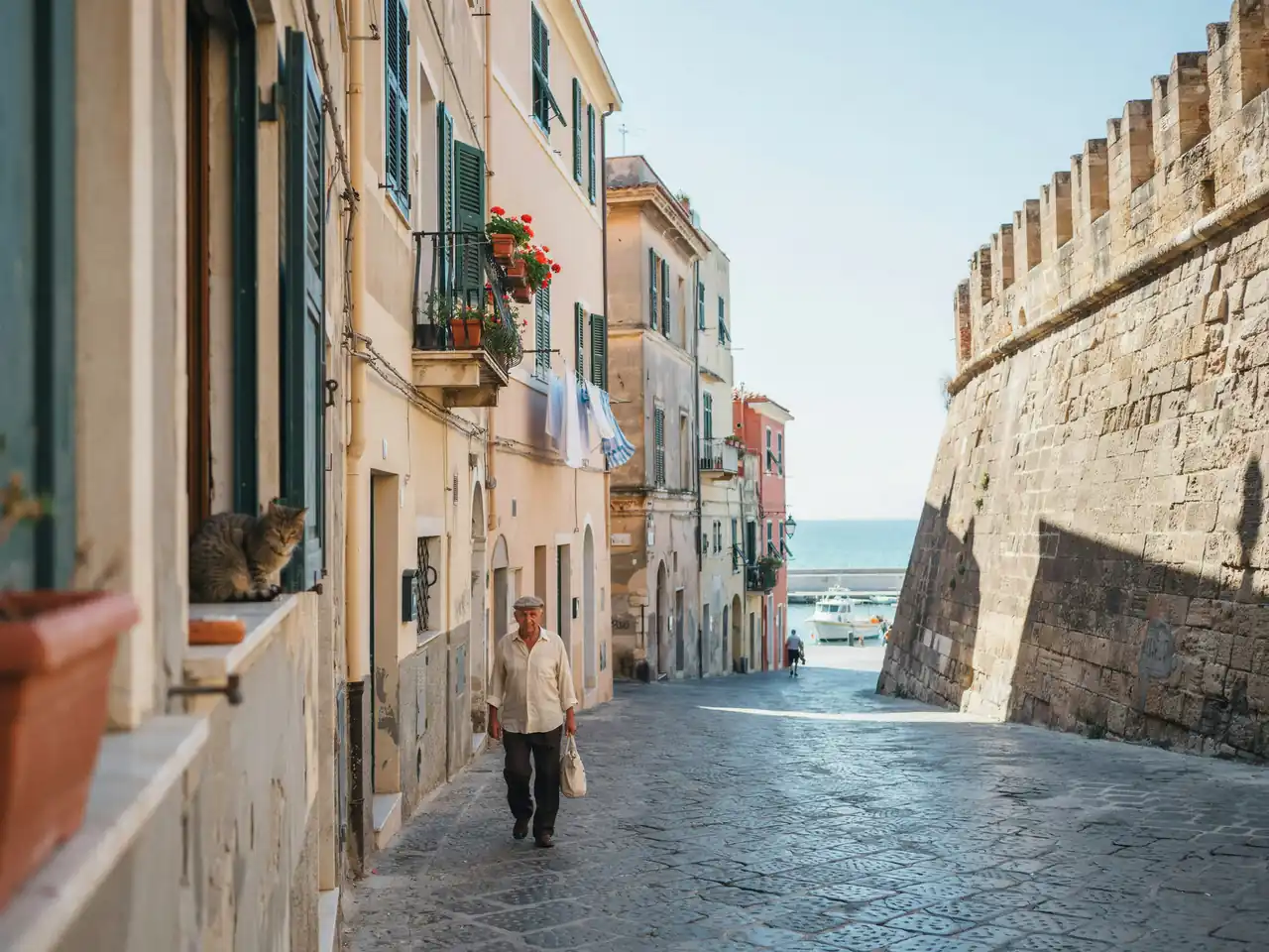 Harbourside streets and historic fortress walls in Civitavecchia under a sunny sky