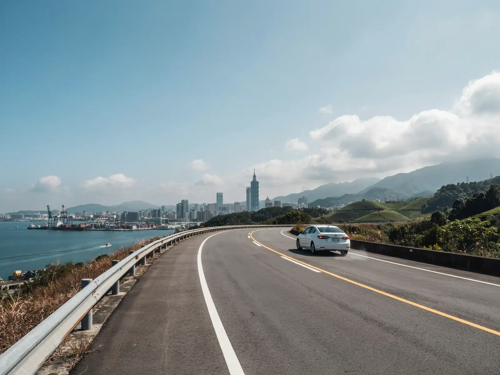 View of the road route from Keelung harbour leading towards the Taipei skyline on a sunny day