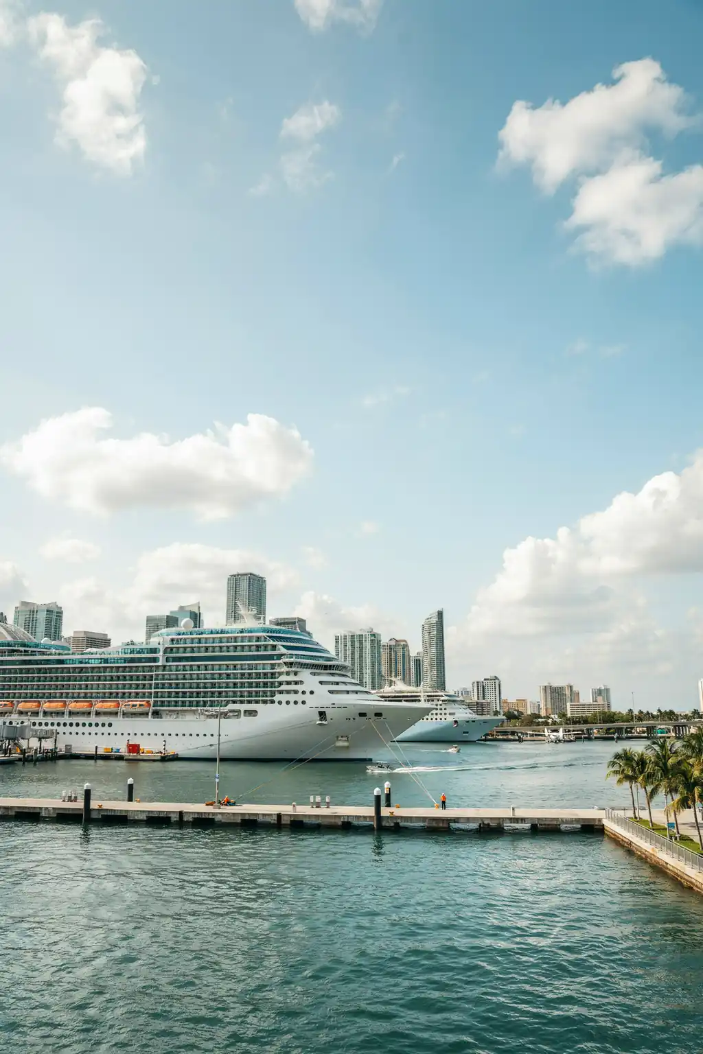 View of the Miami cruise port harbour with the city skyline in the background on a sunny day