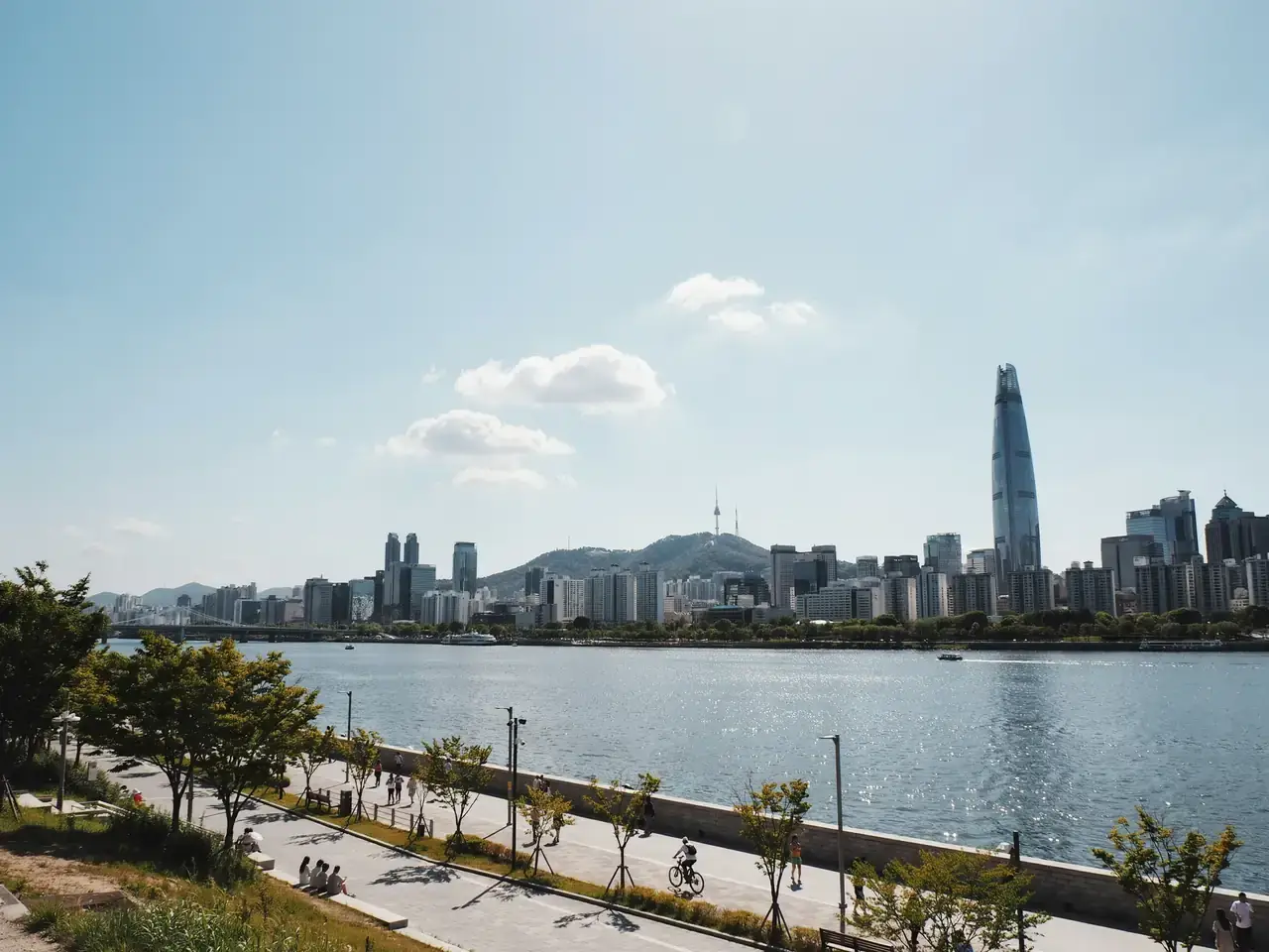 Seoul city skyline with buildings along the Han River on a sunny day