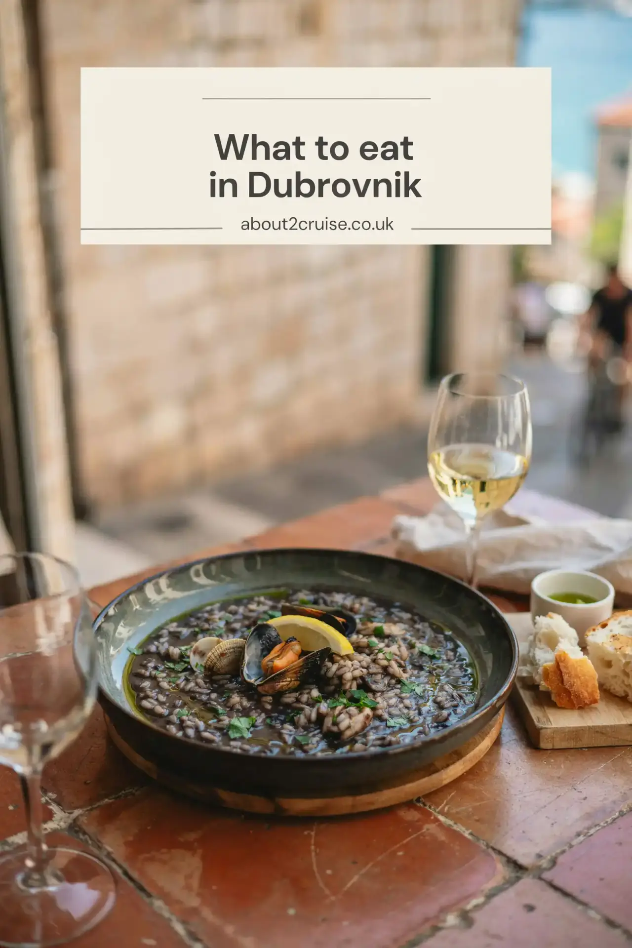 Dubrovnik cruise port: close up of black risotto, a local Croatian dish, served at a sunny cafe table