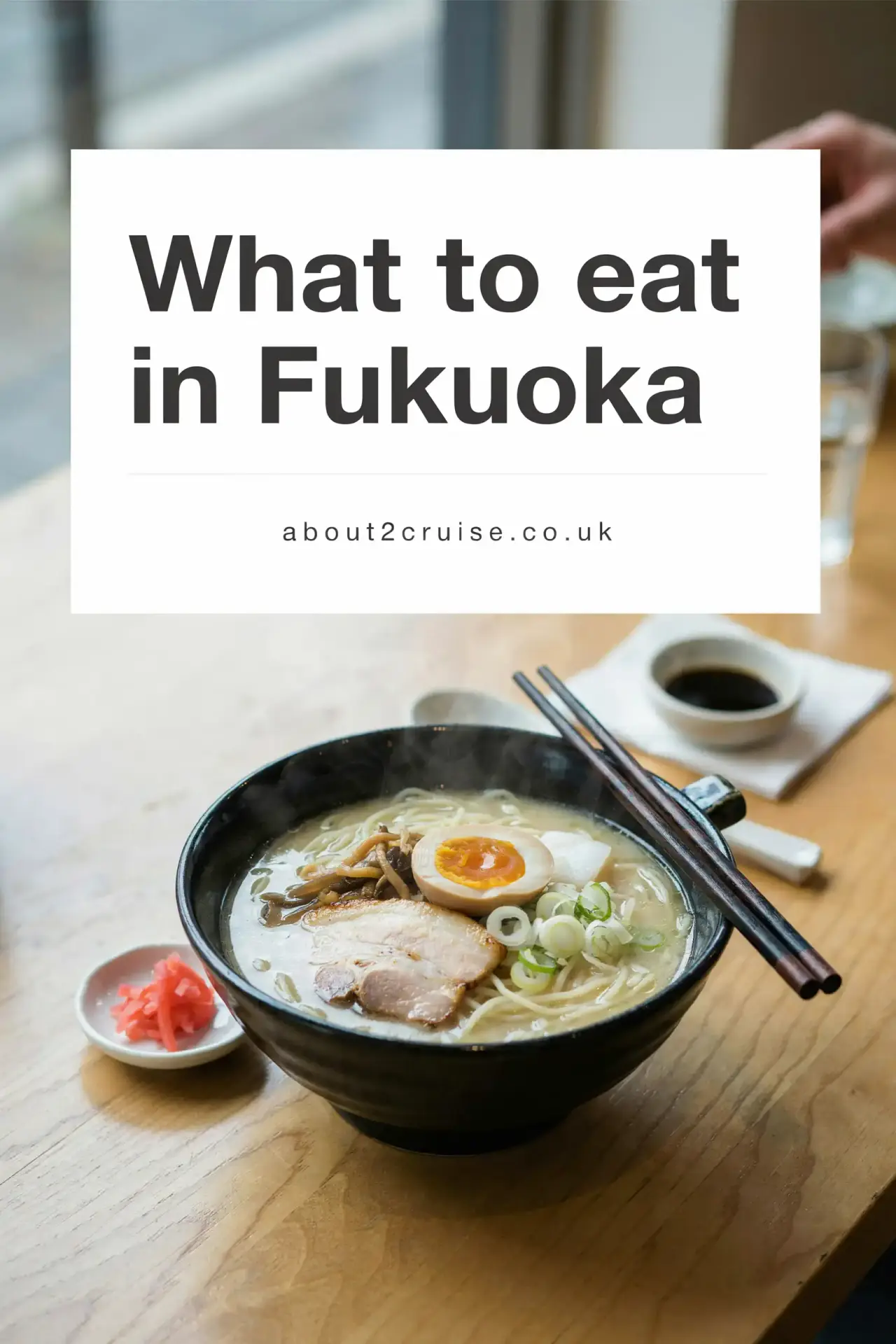 Fukuoka cruise port: bowl of Hakata-style tonkotsu ramen with thin noodles at a sunny cafe table