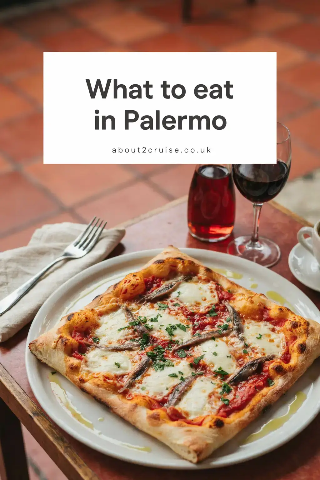 Sfincione, a Sicilian-style focaccia pizza, served at a sunny cafe table in Palermo