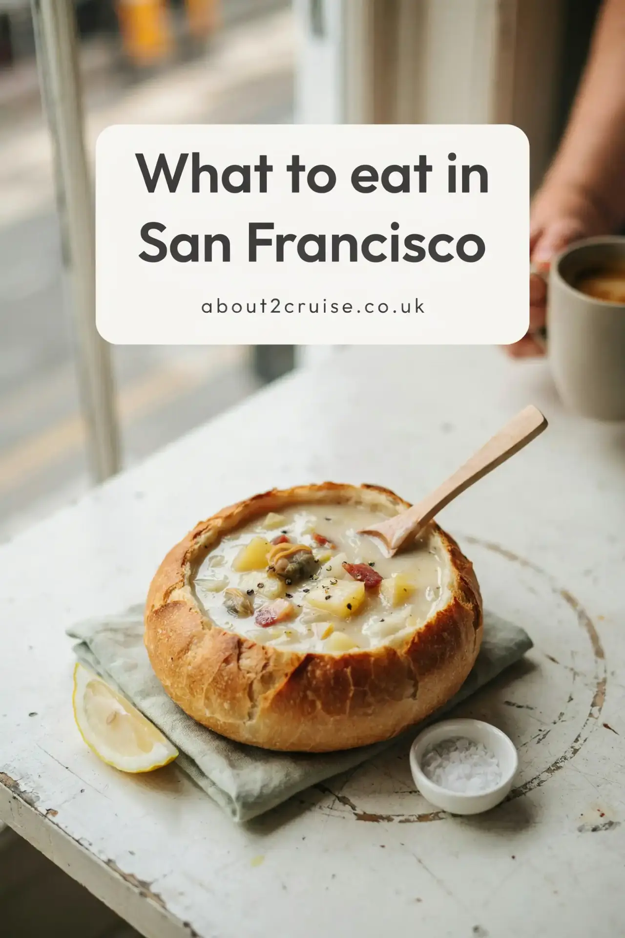 San Francisco cruise port: sourdough bread bowl of clam chowder at a sunny cafe table