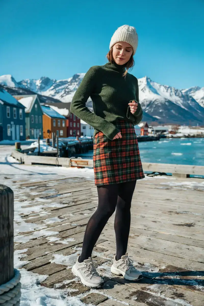 Woman in a tartan wool mini skirt and black thermal tights on an Alaska cruise port day